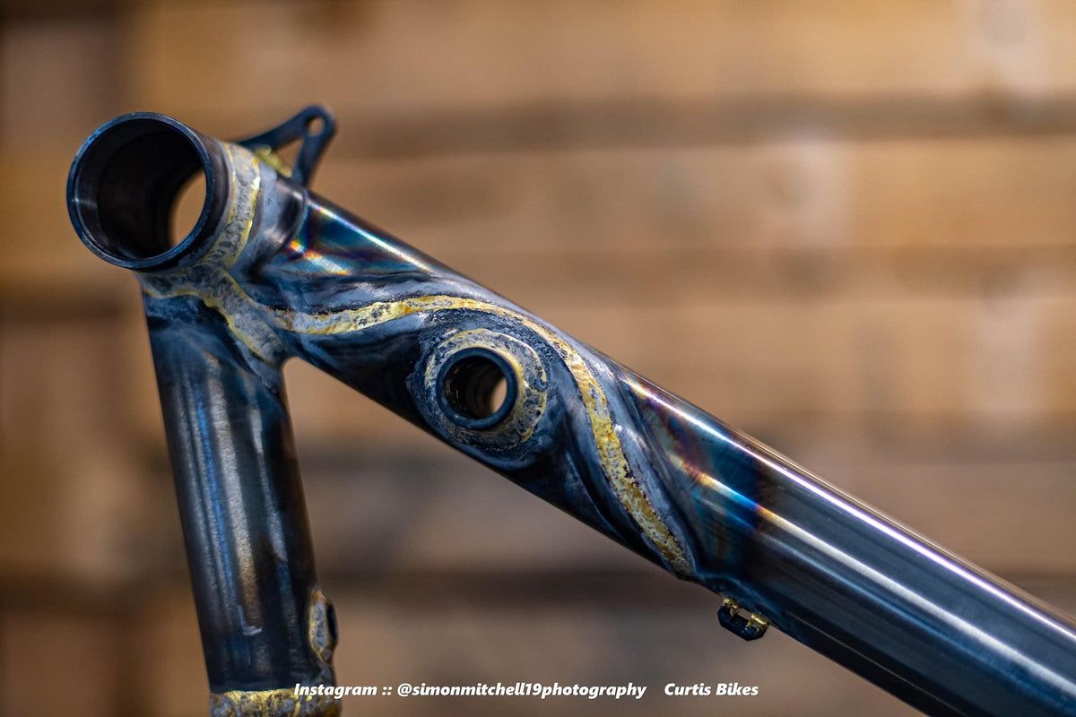 Detailed gold brazing around the Curtis frame suspension linkage